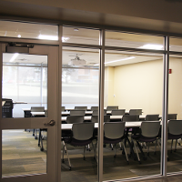 Exterior of the Tuttle Creek Classroom with tables and chairs in a classroom setup.
