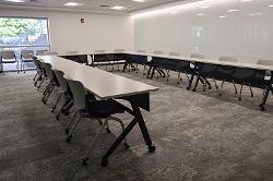 Movable tables and chairs in a presentation configuration.