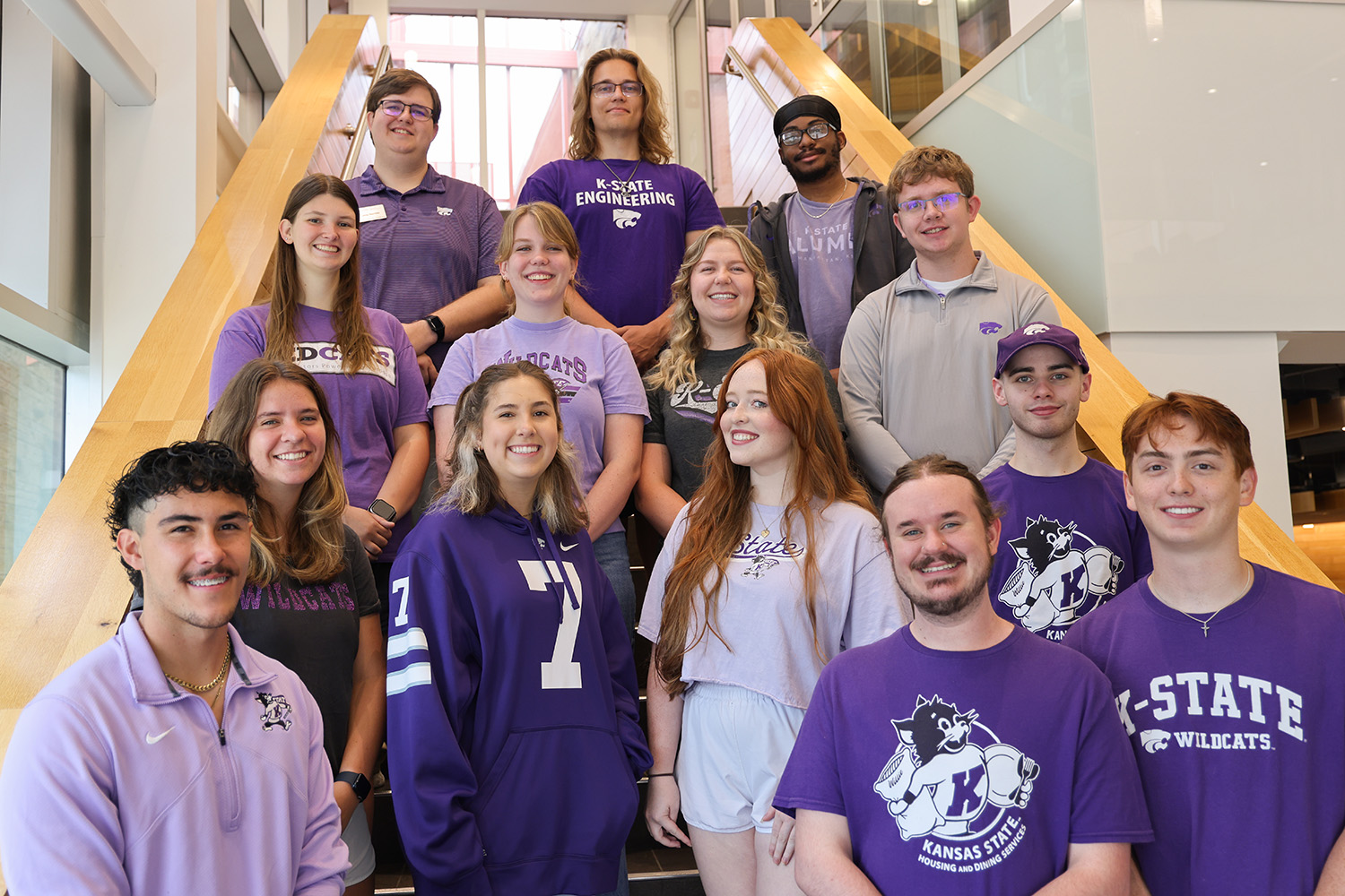 A group of K-State students standing on a staircase.