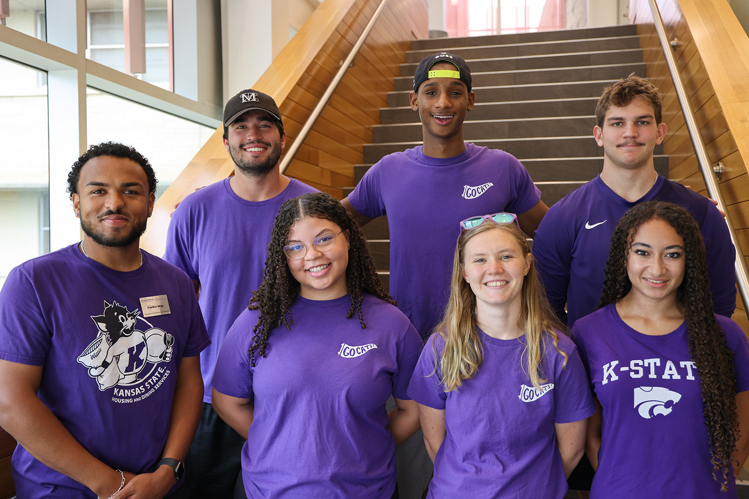A group of K-State students standing on a staircase.
