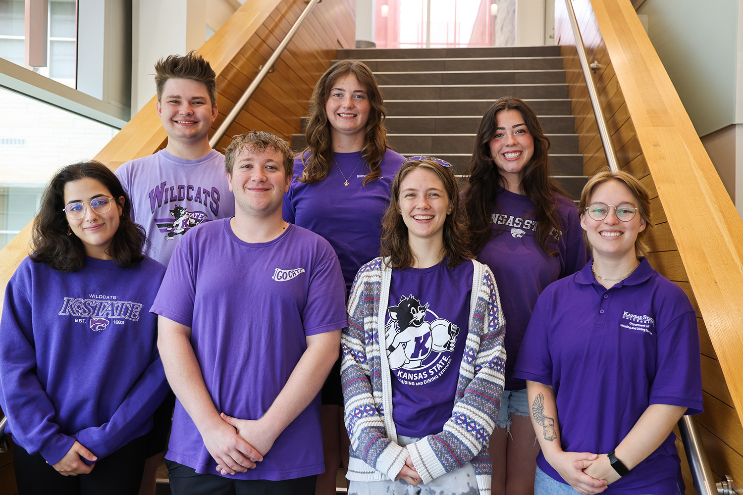 A group of K-State students standing on a staircase.