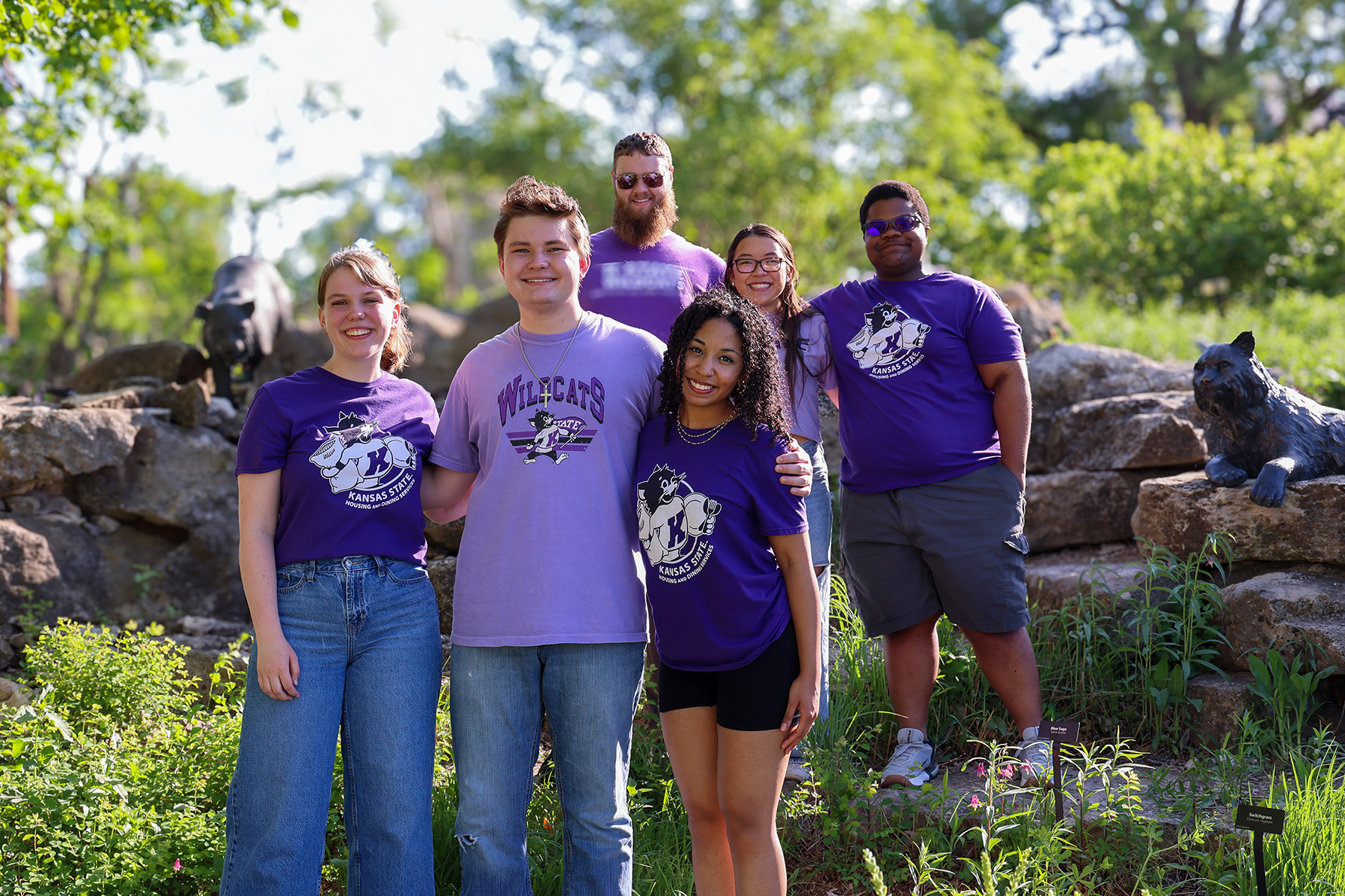Group of K-State student resident assistants standing in the K-State Gardens