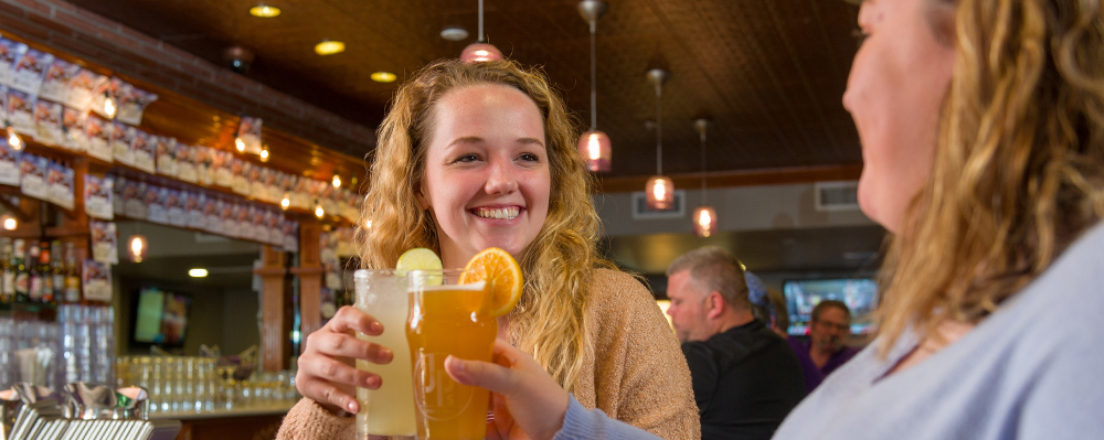 Friends enjoying drinks at JP's Sports Grill